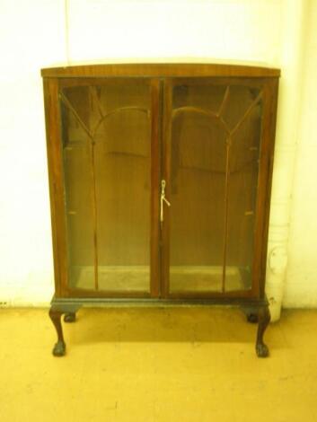 A 1930's mahogany veneered display cabinet with two glazed doors