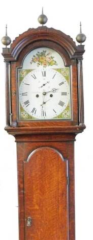 Debenham Sudbury. A 19thC oak long cased clock, the arched dial surmounted by three finials above an arched long trunk door on bracket feet, the 30cm W dial with painted spandrels, signed Subbary (sic) with a Roman numeric dial, subsidiary Arabic second h