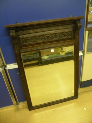 A late Victorian carved mahogany over mantel mirror with a rectangular