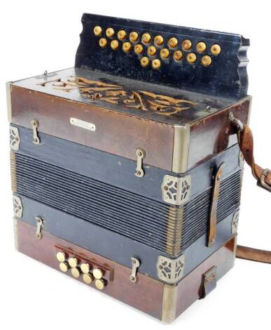 A early 20thC German squeeze box, of rectangular form with twenty one buttons to one side, marked Mussikhaus Koch Munchen, 34cm W.