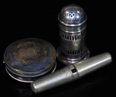 A George V silver pepper pot, of domed form, with compressed circular lid, part pierced body and circular foot, with blue glass liner, 6cm H, 1oz, a Continental snuff box of circular form and a plated travel corkscrew. (3)