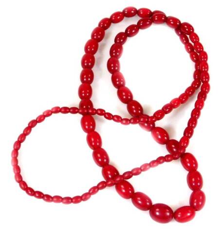 A modern cherry amber beaded necklace, with graduated oblong design beads, the largest 1.5cm wide, the smallest 0.5cm wide, 60g all in.