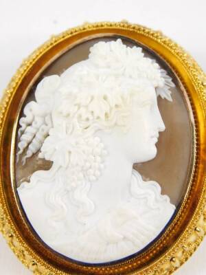 A Victorian oval cameo brooch, set in yellow metal, bust portrait of a lady with vines in her hair, hair locket back, 57mm H, 48mm W. - 2