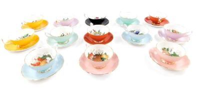 A Shelley Aynsley and Edwardian porcelain harlequin tea service, decorated with fruit, against various coloured grounds, comprising thirteen cups and saucers.