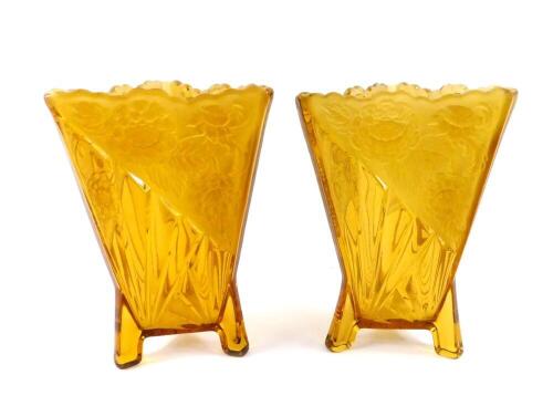 A pair of Art Deco amber glass vases, of triangular form, with moulded fan decoration and frosted glass panels moulded with flowers, 19cm H.