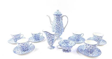 A Royal Doulton early 20thC blue and white porcelain coffee service, decorated with a floral sheet pattern, comprising coffee pot, cream jug, sugar bowl, six cups and saucers.