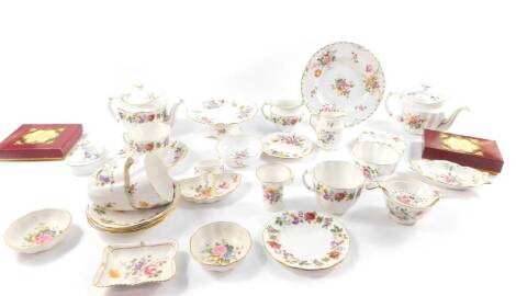 A group of Royal Crown Derby porcelain decorated in the Derby Posies pattern, including teapots, cream jugs, tea strainer, cups, saucers, dishes and napkin rings (qty)