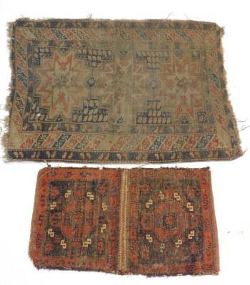 A 19thC Bokhara double bag face, and a Caucasian rug of geometrical design, 133cm x 100cm. (both AF). (2) Auctioneers Note: Rugs have live moth, and all are as found. Viewing is strongly recommended.