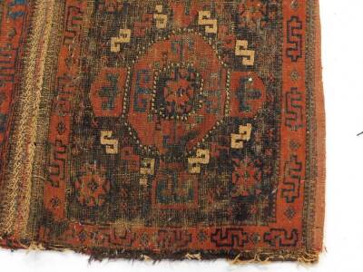 A 19thC Bokhara double bag face, and a Caucasian rug of geometrical design, 133cm x 100cm. (both AF). (2) Auctioneers Note: Rugs have live moth, and all are as found. Viewing is strongly recommended. - 2