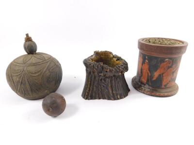 A 19thC coconut carved with a sailing vessel and a bird on a branch, a Victorian terracotta jar with a pierced brass lid, decorated with a band of Greek figures, 11cm H, a horn receptacle, 8.5cm H, and a carved spherical seed pod. (4)