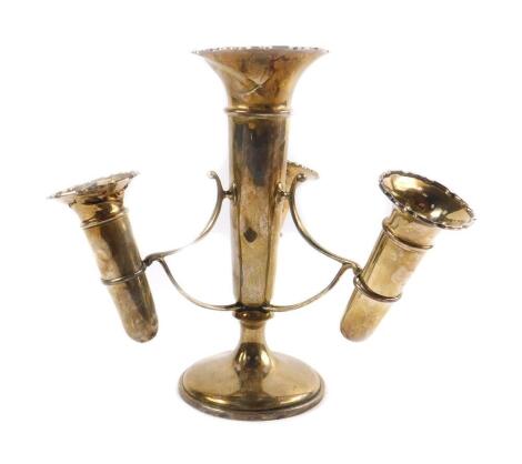 A George V silver three branch epergne, with a central trumpet and three removable trumpets, raised on a cylindrical base, Birmingham/Chester 1912, 20.5cm H, 15.34oz all in.