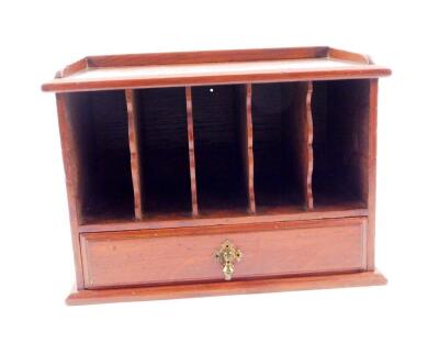 A Victorian mahogany table top pigeon holes cabinet, of rectangular section with five recesses interspersed with shaped dividers, over a frieze drawer, raised on a plinth base, 25cm H, 34.5cm W, 20cm D.