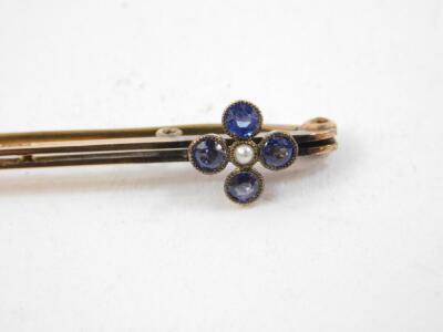 A Victorian seed pearl and garnet brooch, formed as crescent moon and star, set in pierced yellow metal, together with an Edwardian 9ct gold sapphire and seed pearl set floral bar brooch, 4.0g - 3