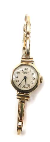 A Bentima lady's 9ct gold wristwatch, with a circular cream dial bearing arabic numerals on a 9ct gold elasticated strap, 15.5g.