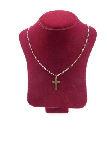 A 9ct gold cross, foliate engraved, on a yellow metal fancy link chain stamped 9, 7.2g all in