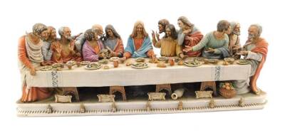 A Capo di Monte porcelain figure modelled as The Last Supper, After Leonard di Vinci, by Giacomo Peolli, incised and printed marks, 29cm H, 86cm W. (AF)