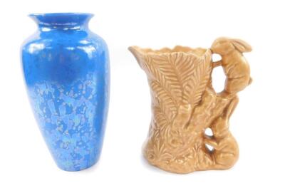 A Sylvac brown fern jug, with double rabbit handle, No 178 impressed marks, 20cm H, together with a Poole blue lustre vase, of shouldered tapering form, printed mark, 26cm H. (2)