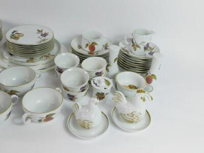 Royal Worcester Porcelain oven to tableware decorated in the Evesham pattern, including a pair of covered vegetable dishes, souffle ramekins, soup cups and saucers, dinner and dessert plates, etc. (qty) - 2