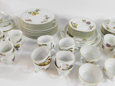 Royal Worcester Porcelain oven to tableware decorated in the Evesham pattern, including a pair of covered vegetable dishes, souffle ramekins, soup cups and saucers, dinner and dessert plates, etc. (qty) - 3