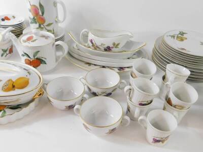Royal Worcester Porcelain oven to tableware decorated in the Evesham pattern, including a pair of covered vegetable dishes, souffle ramekins, soup cups and saucers, dinner and dessert plates, etc. (qty) - 4