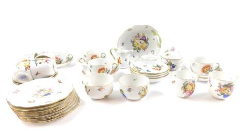 A Herend porcelain part tea and coffee service, painted with fruit and flowers, pattern no 1726, comprising six tea cups and saucers, six coffee cups and saucers, seven tea plates, cream jug and sugar bowl, together with a preserve pot, cover and spoon, a