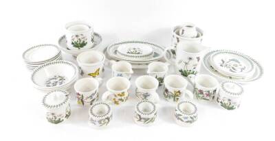 A group of Portmeirion pottery decorated in the Botanic Garden pattern, including oval meat platters, plates and bowls, jardinieres, tea cups, preserve pots, jugs and candle holders. (qty)