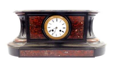 A French late 19thC slate and marble mantle clock, circular enamel dial bearing roman numerals, eight day movement with bell strike, bell lacking, the case of oval serpentine form set with red marble, no key, by Japy Freres numbered 1276 stamped LB and An