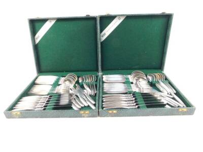 Two cases of WMF silver plated flatware, with double foliate scroll embossed shafts, stamped Hanseat 90.