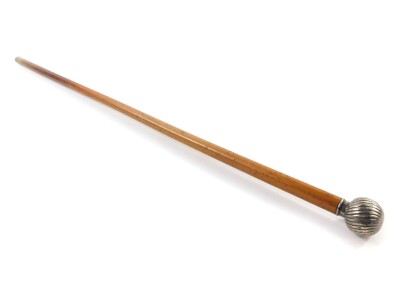 An early 20thC Continental malacca walking cane, with a white metal spiral fluted ball knop, bears marks, 81cm L.