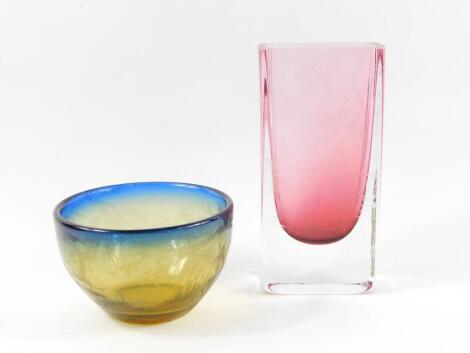 Brian Jabez Francis R.M.S, S.G.A. A cranberry clear glass vase, of rectangular form, acid etched with a Chinese landscape with figure and cooking pot, 20cm H, together with an amber to blue glass bowl, acid etched with a pond and irises, etched mark, 13.5