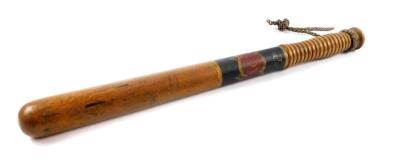 A 19thC police truncheon, with a painted central band with cartouche 'Hackney', E4, with ringed turned handle and plaited rope grip, 43.5cm L.