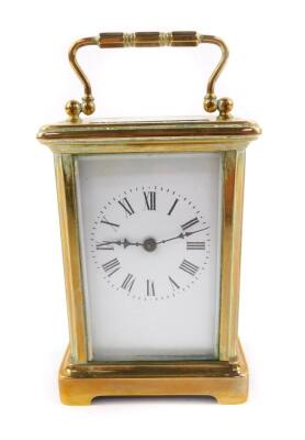 A French brass carriage clock, rectangular enamel dial bearing Roman numerals, single barrel movement, the case of plain form, with key, 11cm H, 8cm W, 6cm D.