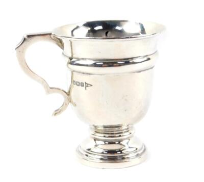 A George V silver christening tankard, of baluster form, Walker & Hall, Sheffield 1910, 2.88oz.