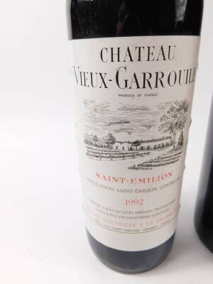 Three bottles of Chateau Vieux-Garrouilh Saint-Emilion 1992, together with a bottle of Puissegeuin-Saint-Emilion Grand Vin 1990, a bottle of Chateau La Chapelle des Tours Montagne Saint-Emilion 1988, and a bottle of Bordeaux 2002. (6) - 2