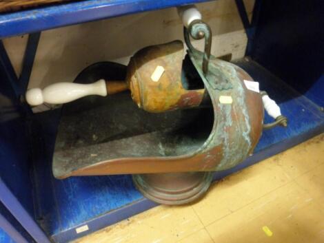 A Victorian copper coal scuttle with glass handles