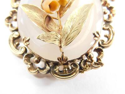 A Victorian Lily of the Valley brooch, with ivory Trembluse flowers and yellow metal leaves, on a white crystal backing, in a yellow metal rococo scroll open surround, with safety chain as fitted. - 2