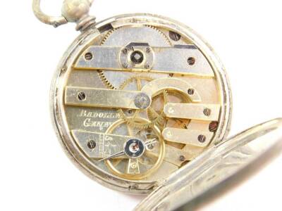 A late 19thC lady's pocket watch, open face, key wind, white metal dial with floral engraving, chapter ring bearing Roman numerals, the case with engine turned decoration shield reserve, with a watch key, together with a silver curb link Albert chain, wit - 4