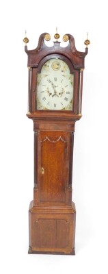 A George III mahogany and oak long case clock, the break arch dial painted with shells, thistles, rose and bird, chapter ring bearing Roman and Arabic numerals, subsidiary seconds dial and date aperture, two train eight day movement, with bell strike, the