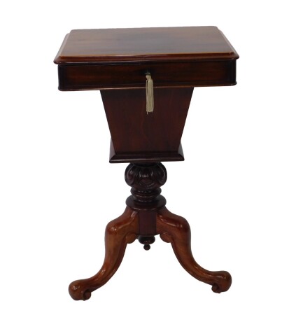 A Victorian mahogany and box wood line inlaid trumpet sewing table, the rectangular hinged lid opening to reveal a fitted interior with sewing accoutrements, raised on a carved column, over three cabriole legs, 72cm H, 46cm W, 36cm D.