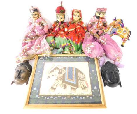 Two carved Indian puppets, painted as a man and woman, in pink costume, the man playing a musical instrument, each 62cm H, together with an elephant figure, and two further carved wooden puppets, two plaster Buddha wall plaques, 18cm H, and an Indian wate