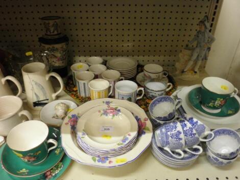 A quantity of china, figurines, mugs, two nursery rhyme miniature saucers etc