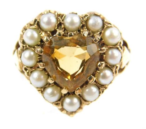 A citrine and seed pearl ring, in a yellow metal heart shaped setting, stamped 9ct, size L, 5.4g.