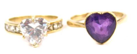 A 9ct gold and amethyst heart shaped solitaire ring, size O, and a 9ct gold and cubic zirconia heart shaped ring, the shoulders set with square cut zircons, size L, 7.2g. (2)