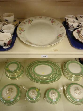 A green printed dinner service