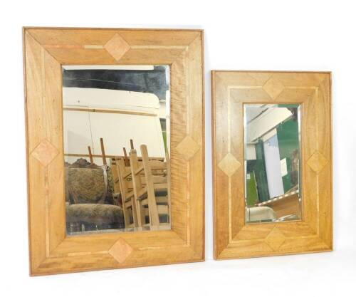 A pair of graduated mango wood and marble inlaid rectangular wall mirrors, inset bevelled glass, 120cm x 90cm and 101cm x 70cm.