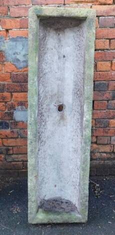 A 19tchC rectangular hand hewn stone trough, 26cm H, 141cm W, 41cm D.