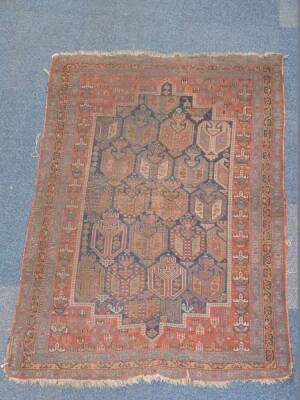 A Turkish design rug, with multi gul central field on a blue ground enclosed by a red border with guls within a triple border on a blue ground, 163cm x 118cm. (AF) Auctioneers Note: Rug has live moth, and all are as found. Viewing is strongly recommended