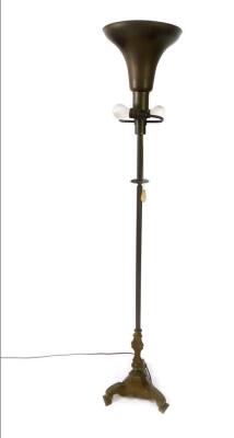 A Victorian and later brass uplighter, with a trumpet shaped shade and two side arm lights, raised on a fluted column and triform base, 171cm H.