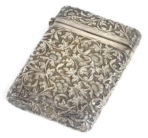 A silver coloured metal card case, with embossed and repousse decoration of foliate scrolls, flowers, etc., indistinct mark possibly Chinese, 10cm x 7cm.