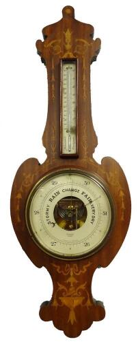 An Edwardian mahogany and marquetry wheel barometer by Dolland of London, the shaped case decorated with foliate scrolls, ribbons, etc., with an aneroid barometer and thermometer above, 85cm H.